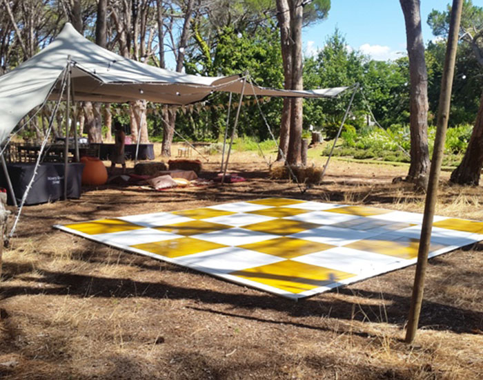 Yellow and white dance floor on Sand